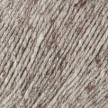 A close up of the strands of the yarn in an earthy, light brown color.  