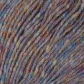 This closeup photo of yarn shows it's soft texture in a blue and brown tweed colorway.
