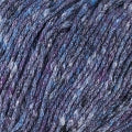 A dark shade of deep blue with tweedy specks of white in this photo showing the soft texture of the yarn strands of Berroco Gaia.