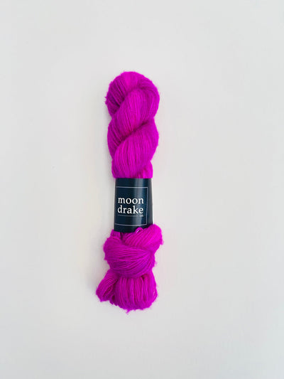 An electric berry skein of brushed cashmere and merino yarn.