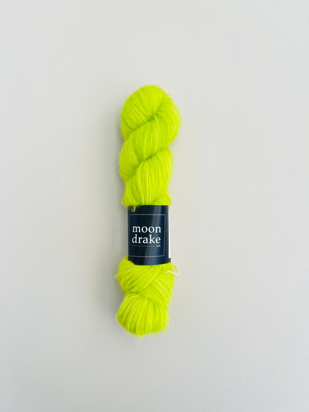 An acid green skein of textured yarn.